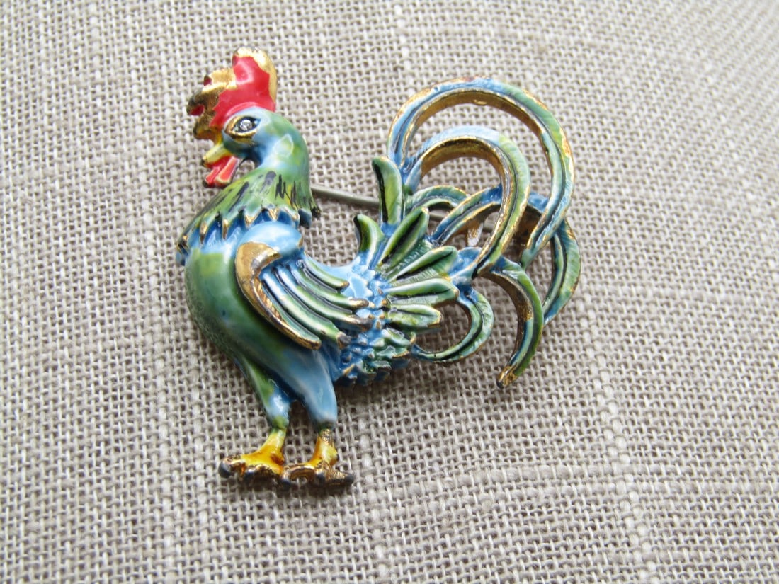 Vintage Enameled Rooster Brooch, Orignal by Robert , 1940's-1950's: Vintage Enameled Rooster Brooch, Orignal by Robert , 1940's-1950's. Enameled in blues and greens on the body and tails with an orange/red comb and yellow feet. Gold tone base. The brooch is appx. 2" t