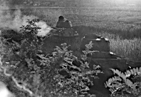 13X19" LG FORMAT, KOREAN WAR_Two enemy Model T-34 tanks, hidden in valley along the Inchon-Seoul: Title: 13X19" LG FORMAT, KOREAN WAR_Two enemy Model T-34 tanks, hidden in valley along the Inchon-Seoul Road, were knocked out by a 3.5 rocket team. Near Ascom City, Korea Artist/Source: US DEFENSE DE