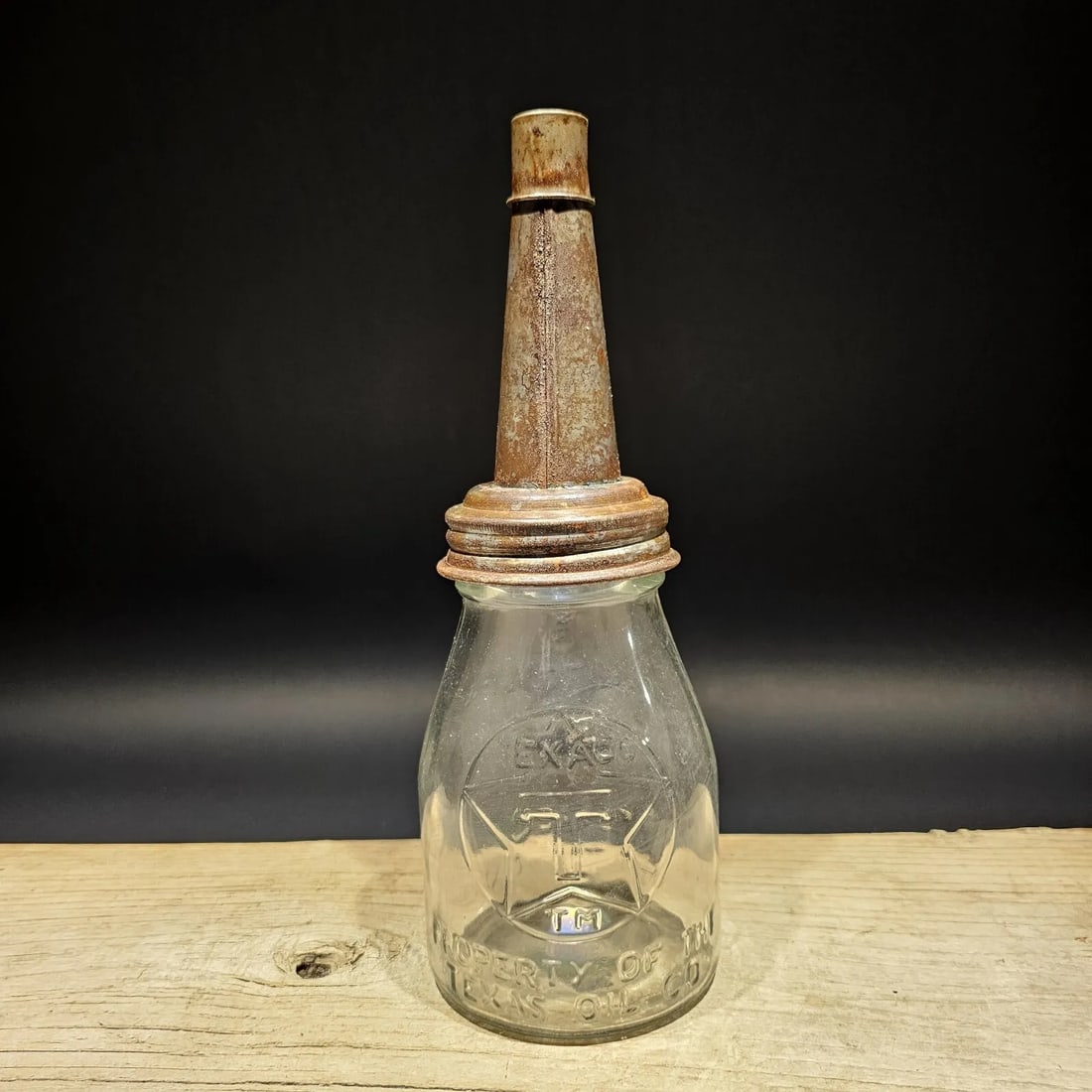 Glass 1 Pint "Texaco" Oil Bottle with Spout: 11" tall x 4" Wide Well made reproduction antique Texaco 1 Pint oil bottle. It's hard to see in the pictures, but it has the Texaco logo and Property of the Texas oil co on the one side. Then Fill to