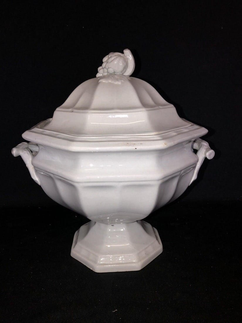 Ironstone Soup Tureen: It measures 10 3/4” x 9 1/2” x 11” high and is marked. It has a tiny flake on the rim where the lid sits, 2 shallow flakes on the underside of the base rim, a tiny manufacturing flaw