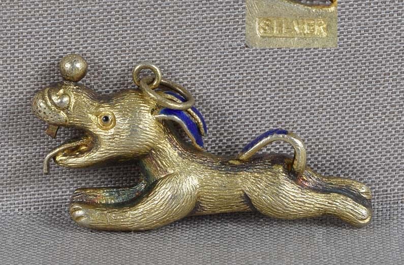Vintage Chinese SILVER gold wash & enamel PENDANT RUNNING DOG: Vintage Chinese silver with gold wash and enamel pendant in a form of a running dog with its tongue sticking out and balancing a ball on its nose. Very well made, excellent depiction of its fur, in ex