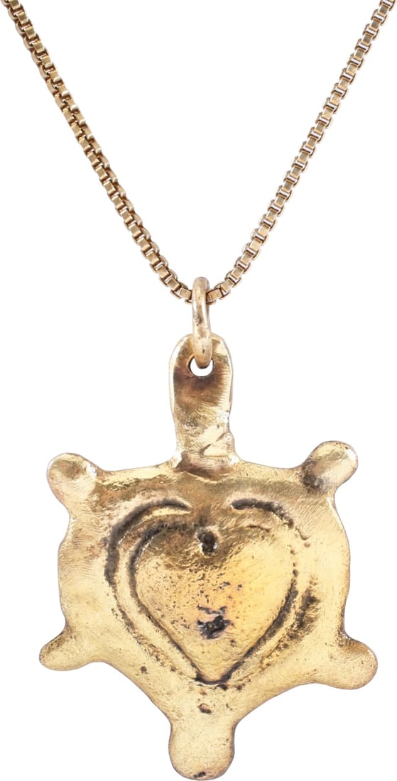 FINE VIKING HEART NECKLACE, C.900-1050 AD.: Just under 3/4" width. Fully developed form with cusped top and nubs at the sixth points defining a saltire. The center with a high domed heart. A heart within a heart! Domed section, made by the open