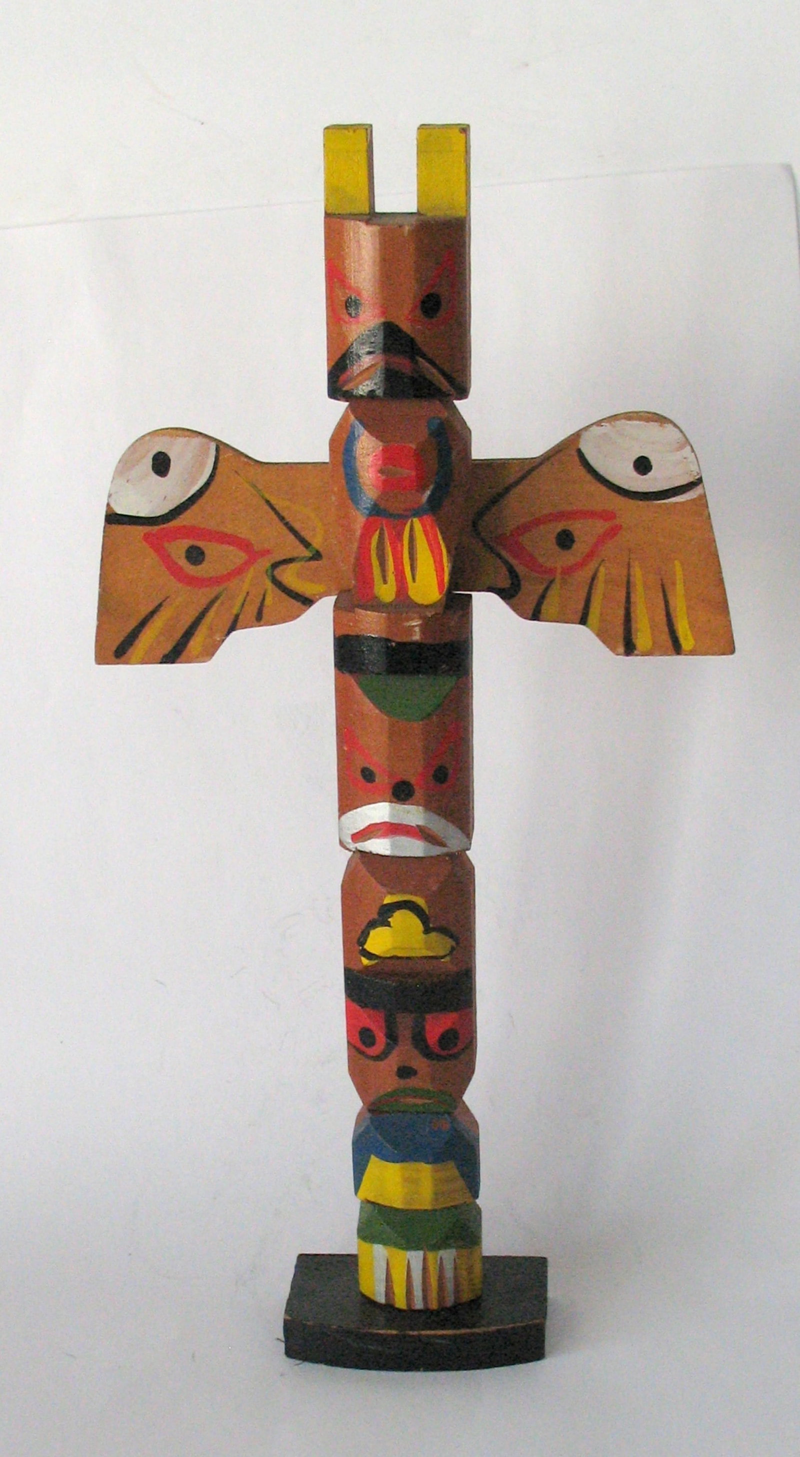 Vintage tourist trade souvenir totem pole.: Title: Vintage tourist trade souvenir totem pole. Date/Period: 1950's Dimension: 10 1/2” high Additional Information: Nice vintage Northwest tourist trade souvenir totem pole in all original pai