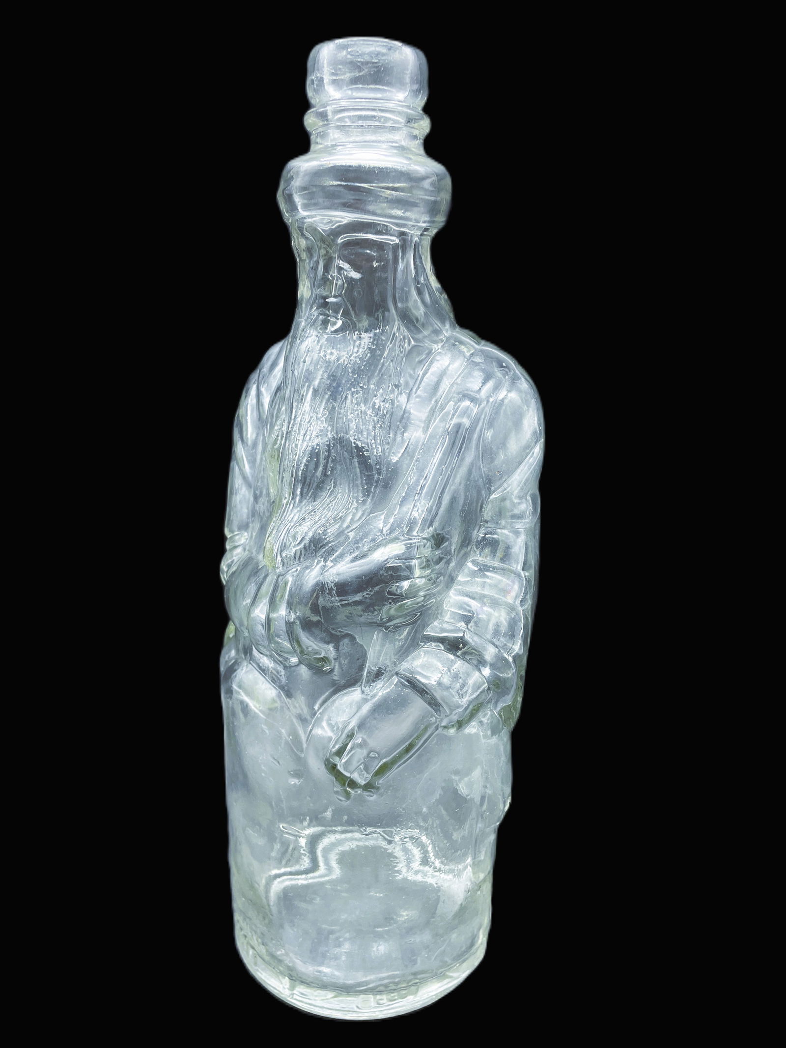 POLAND MINERAL SPRING WATER CLEAR FIGURAL BOTTLE SHAPED LIKE MOSES or SANTA CLAUS: Title: POLAND MINERAL SPRING WATER CLEAR FIGURAL BOTTLE SHAPED LIKE MOSES or SANTA CLAUS Date/Period: unknown Dimension: approx. 10.75 x 4 Material: glass Additional Information: Figural bottle shaped