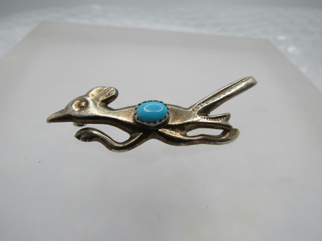 Vintage Sterling Southwestern Turquoise Roadrunner Brooch, 1960's-1970's. 2": Vintage Sterling Southwestern Turquoise Roadrunner Brooch, 1960's-1970's. 2" wide and 1" tall at the tall to the feet. It has an oval sleeping beauty sawtooth bezel-set turquoise stone that is appx. 7