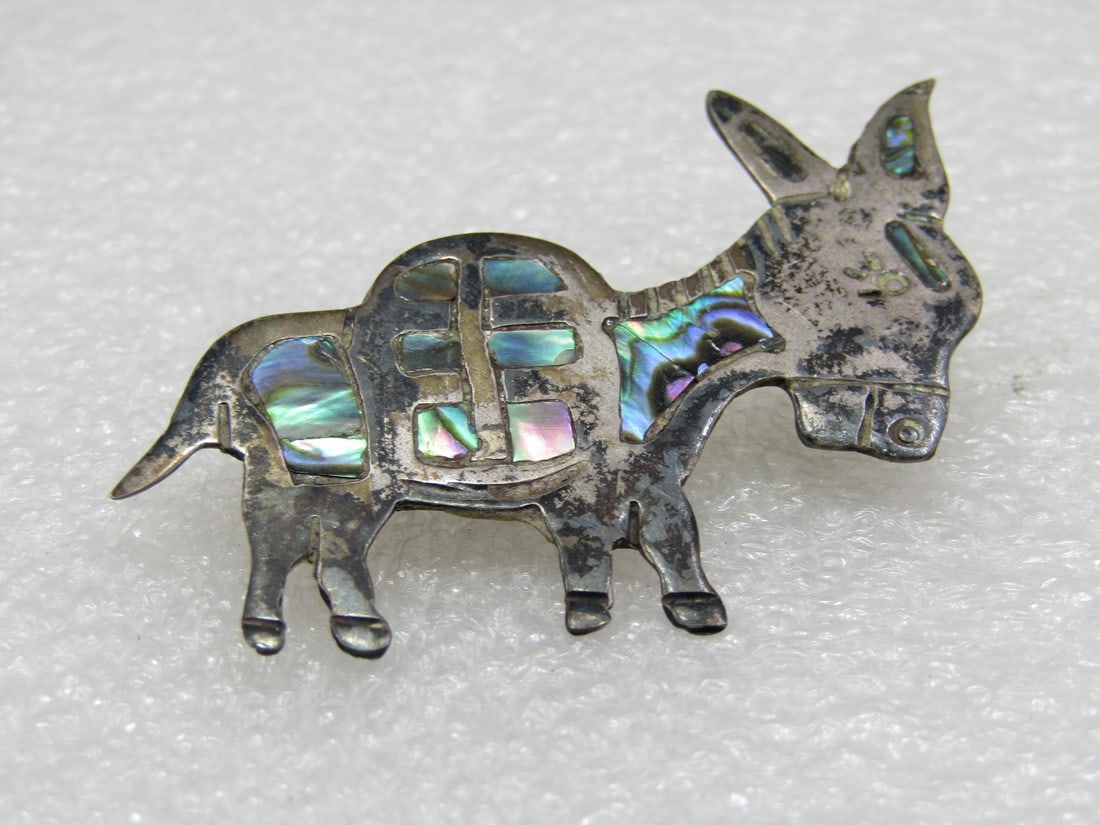 Vintage Sterling Inlaid Abalone Donkey Brooch, Mexico, Signed: Vintage Sterling Inlaid Abalone Donkey Brooch, Mexico, Signed what looks like ERB and also marked Hecho en Mexico and .925. Tested. Weight is appx. 6.36 gr. Appx. 2" long and 1.5 from ears to hooves.