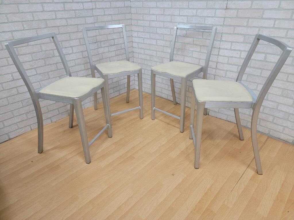 Modern Emeco Icon Brushed Aluminum Bar Stools by Philippe Starck - Set of 4: Ships from Illinois! Shorter shipping distances are kinder to the planet Ordering items closer to you is more likely to reduce your purchase's carbon footprint. Materials: aluminum, metal, fabric Over