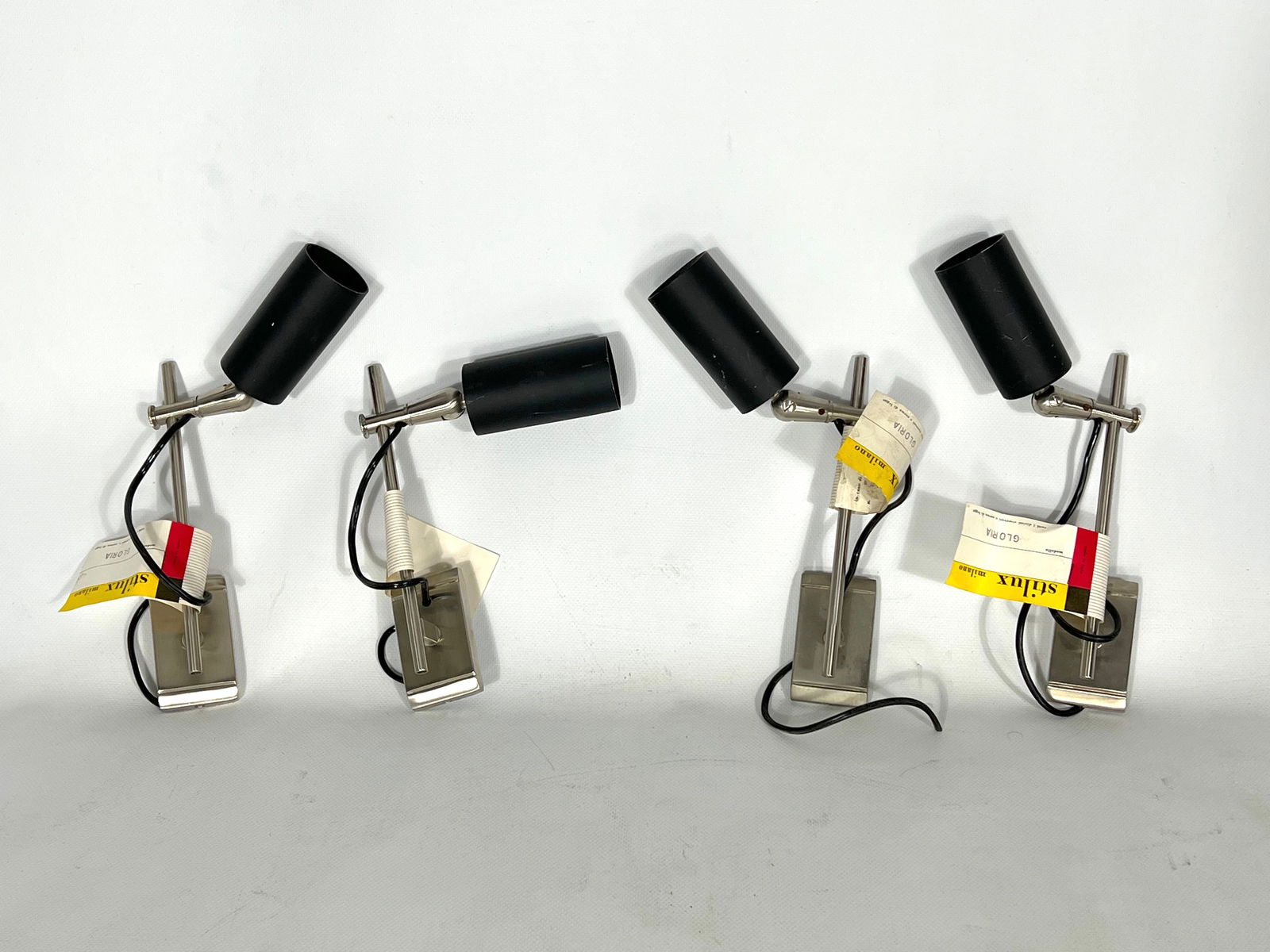 Mid-century modern set of four inedited orientable Gloria model spotlights by Stilux Milano: Great vintage condition with small trace of age and use for this set of four inedited and rare orientable spotlights produced in Italy during the 60s by Stilux Milano. Stock fund with original label a
