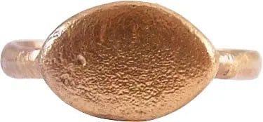 MEDIEVAL EUROPEAN RING, 6TH-9TH CENTURY AD, SIZE 9: Gilt bronze, size 9 with deeply rounded 3.1mm width band and raised lenticular bezel. Probably intended for use as a signet but left uncut and serving as a wedding ring. As such it would indicate a mi