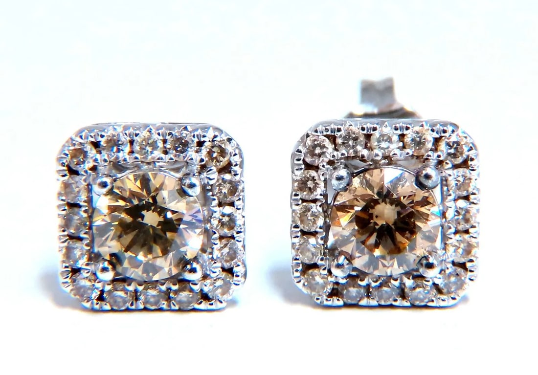 1.30ct Natural Round Diamond Stud Earrings 14 Karat Halo Fancy Brown: Halo Studs Diamond earrings. 1ct Natural Round brilliant diamonds (2) Si-1 clarity / Fancy Brown .30ct Round Diamond Accents Sorround K-color, Si-1 clarity. Earrings: 7.5mm diameter 14kt. white gold 1