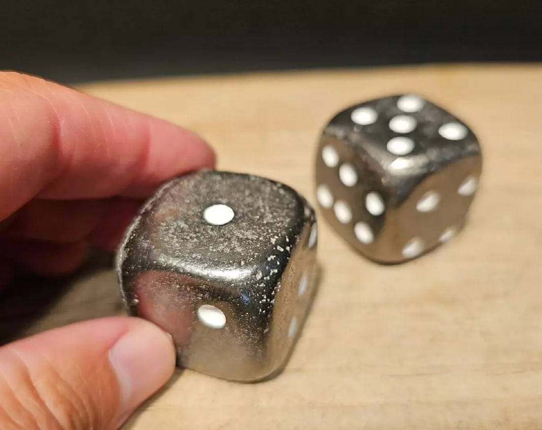 (2) 1 1/4" Iron Dice: 2 1 1/4" Dice Introducing the extraordinary Wonderful Reproduction Set of Dice—a testament to the artistry and craftsmanship of handmade dice. Each die in this set bears the charming signs of being