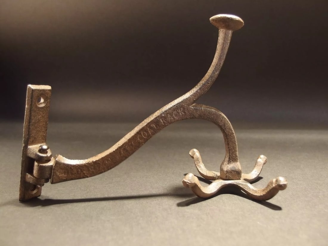 Cast Iron Hook Swivel Bracket Spinning Coat Hanger: 5 1/2" Tall.. 3" Wide 7 1/2" Extension 1 Charming and functional sturdy iron wall hook cast from an antique. Notice not only do the 4 hooks at the end rotate. The entire arm swivels. All Heavy cast ir