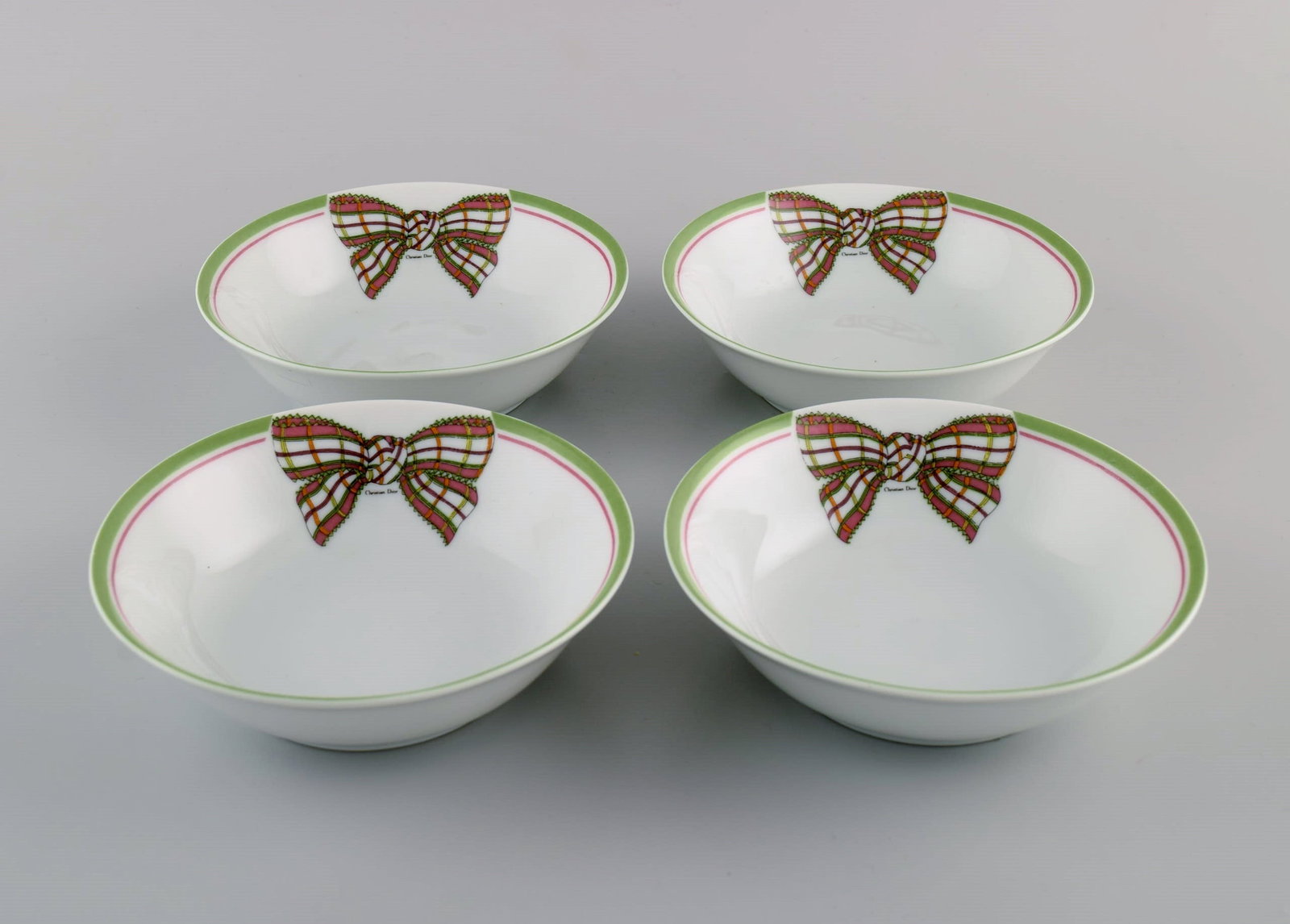 Limoges, France. Four rare Christian Dior "Spring" bowls in porcelain decorated with ribbon and bow. (1 of 5)