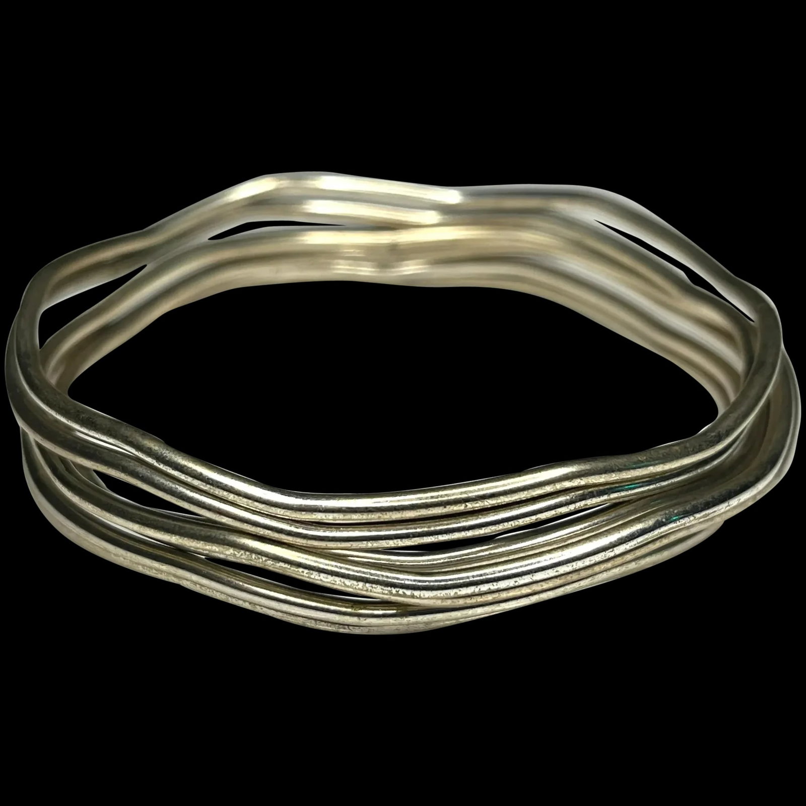 Vintage stack of Sterling Silver Bangle Bracelets with wavy detail: Title: Vintage stack of Sterling Silver Bangle Bracelets with wavy detail Description: Vintage stack of Sterling Silver Bangle Bracelets with wavy detail. 2.5-inch circumference Date/Period:Vintage Ma
