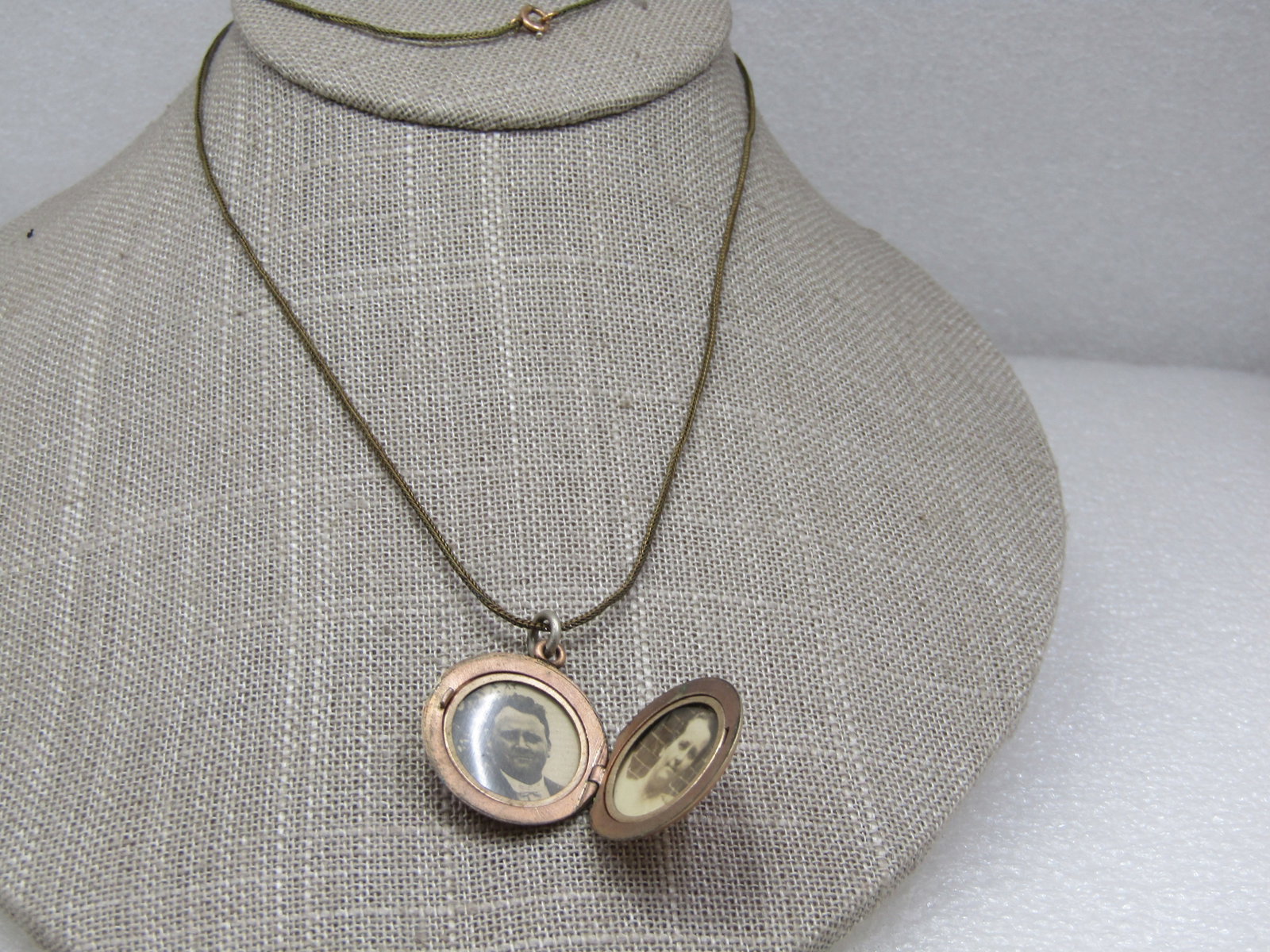 Vintage 10kt G.F. Locket Necklace, 24": Vintage 10kt G.F. Locket Necklace, 24". Foxtail link chain that is appx. .08mm. The locket is 7/8" round with two photos on the inside with plastic covering and bezel that holds everything in place. T