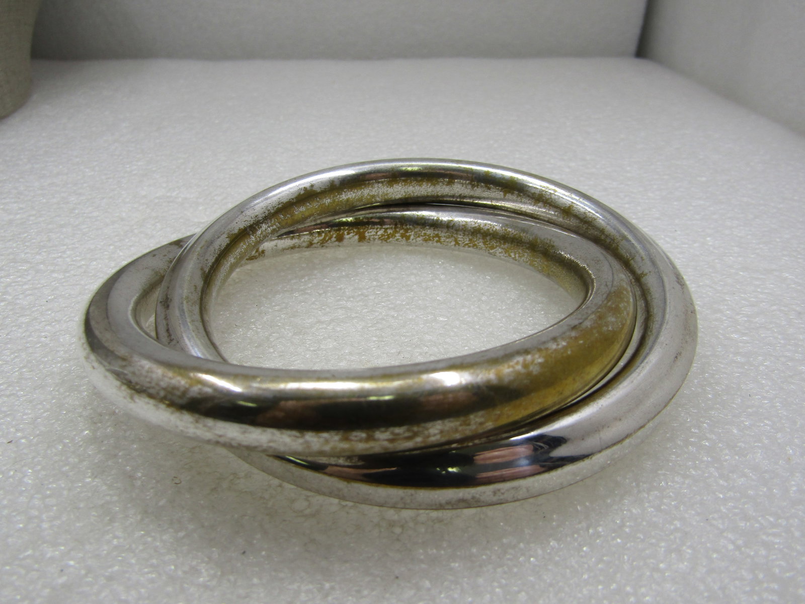 Vintage Heavy Silver Tone Intertwined Bangle Bracelets, 8": Vintage Heavy Silver Tone Intertwined Bangle Bracelets, 8". they have a 2.75" opening. They are rounded with ridged areas around the bangle. The bangles are appx. 10mm . The are a shiny silver metal b