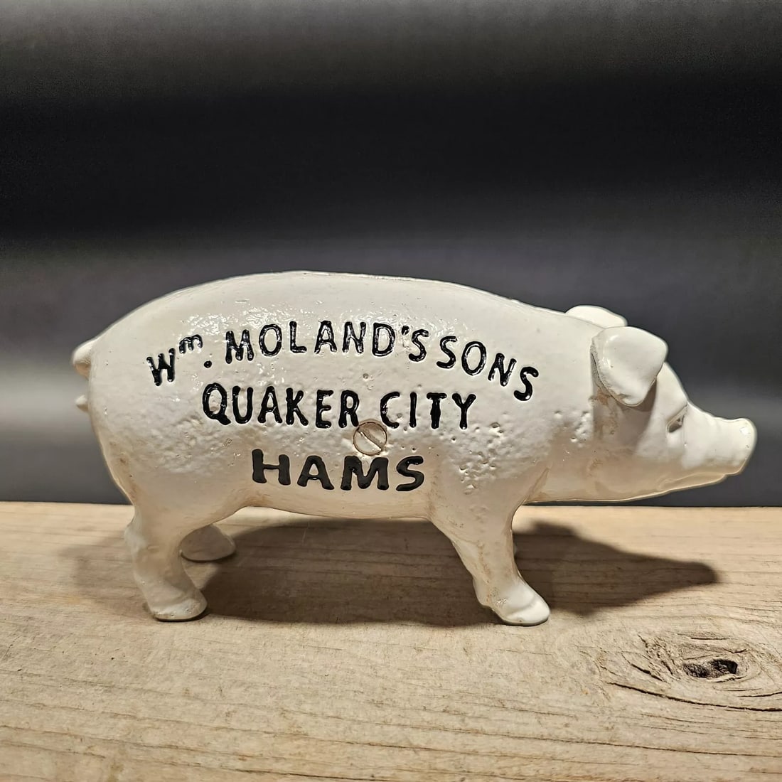 Cast Iron Quaker City Hams Pig Coin Bank: 7 1/2" Long x 2 1/2" Wide Great reproduction folk art cast iron coin bank. This piece was made to look just like an antique, but is actually new. Reserve: $30.00 Shipping: Domestic: Flat-rate of $18.0