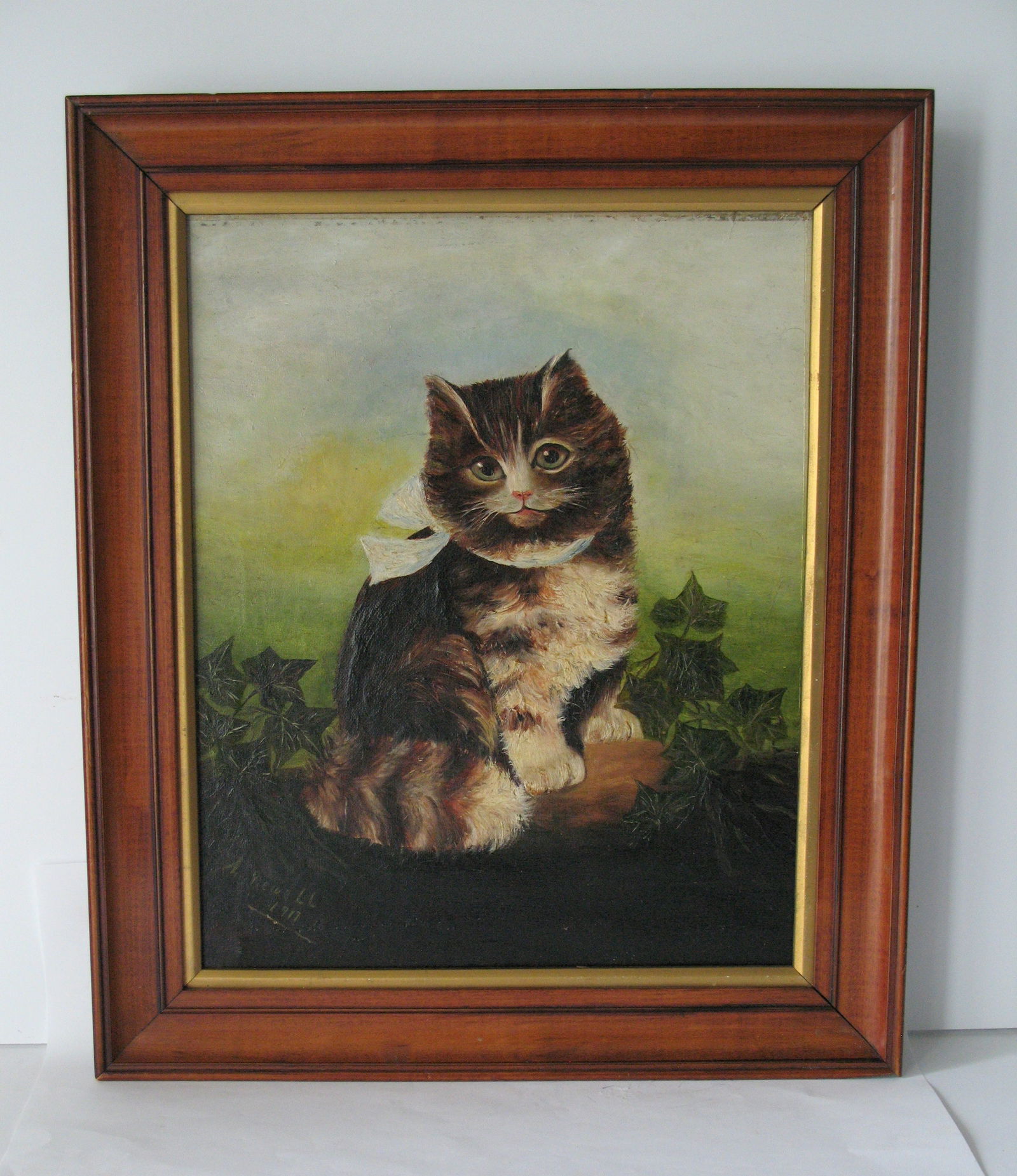 Antique oil painting of a cat dated 1917. (1 of 6)