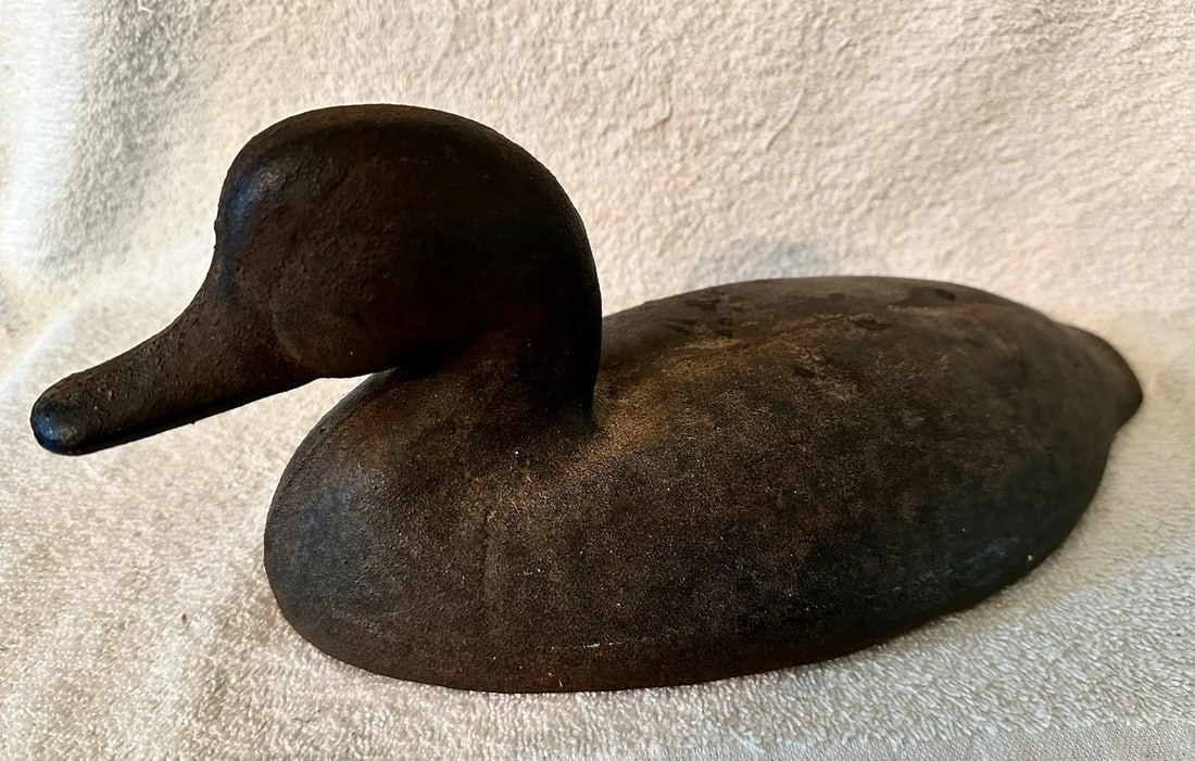 Iron Sink Box Duck Decoy c.1900: A cast iron Sink Box Duck Decoy dating to the very early 20th century, or a bit older. These iron decoys were used as ballast on sink boxes or punt boats that were used for hunting waterfowl. These re