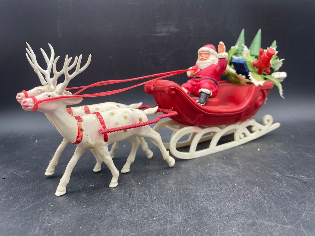 Vintage SANTA SLEIGH REINDEER TREE PRESENTS: Title: Vintage SANTA SLEIGH REINDEER TREE PRESENTS Date/Period: approx 1950-60's Dimension: approx 11.5 x 6 Material: plastic Additional Information: Vintage SANTA SLEIGH REINDEER TREE PRESENTS HONG K
