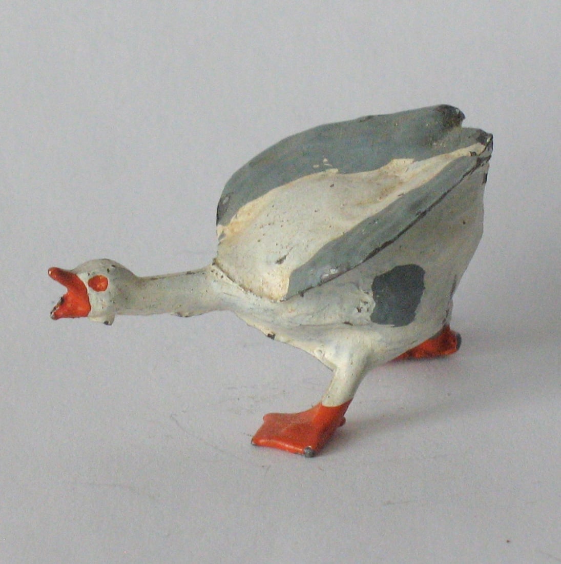 Vintage cast metal honking goose with an attitude.: Title: Vintage cast metal honking goose with an attitude. Date/Period: 1930's Dimension: 1 1/2” Additional Information: Nice vintage cast metal honking goose with an attitude in great all origin