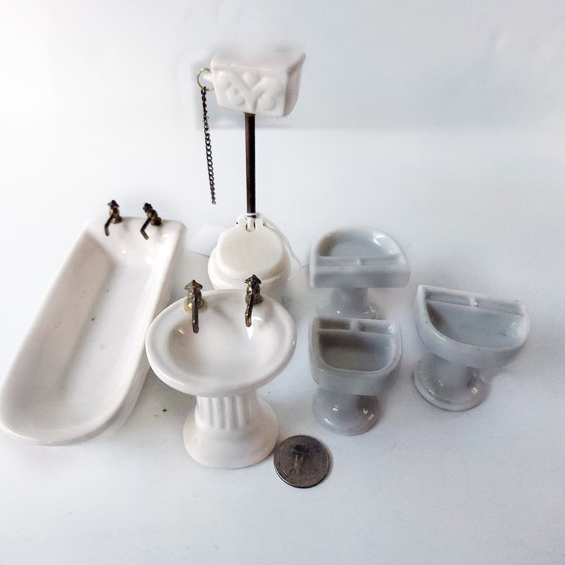 Miniature Dollhouse Porcelain Bath Sets: Title: Miniature Dollhouse Porcelain Bath Sets Date/Period: 20th C Materials: porcelain Additional Information: Miniature Dollhouse Porcelain Bath Sets 3 vintage porcelain sinks made in Occupied Japan