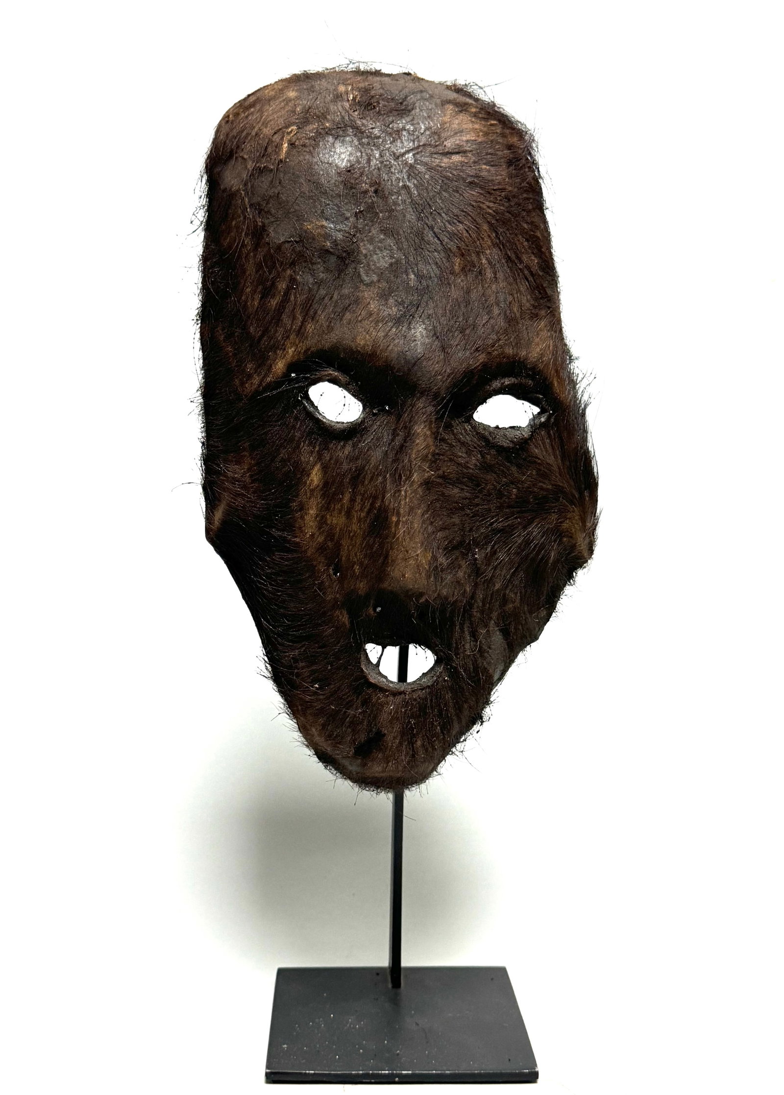 Shaman yak mask - Himalayas - Nepal: Shaman mask from the Himalayas in Nepal. This mask is made of yak leather. These masks are made traditionally by first processing wood into the desired shape. The wood is then rubbed with yak butter, 