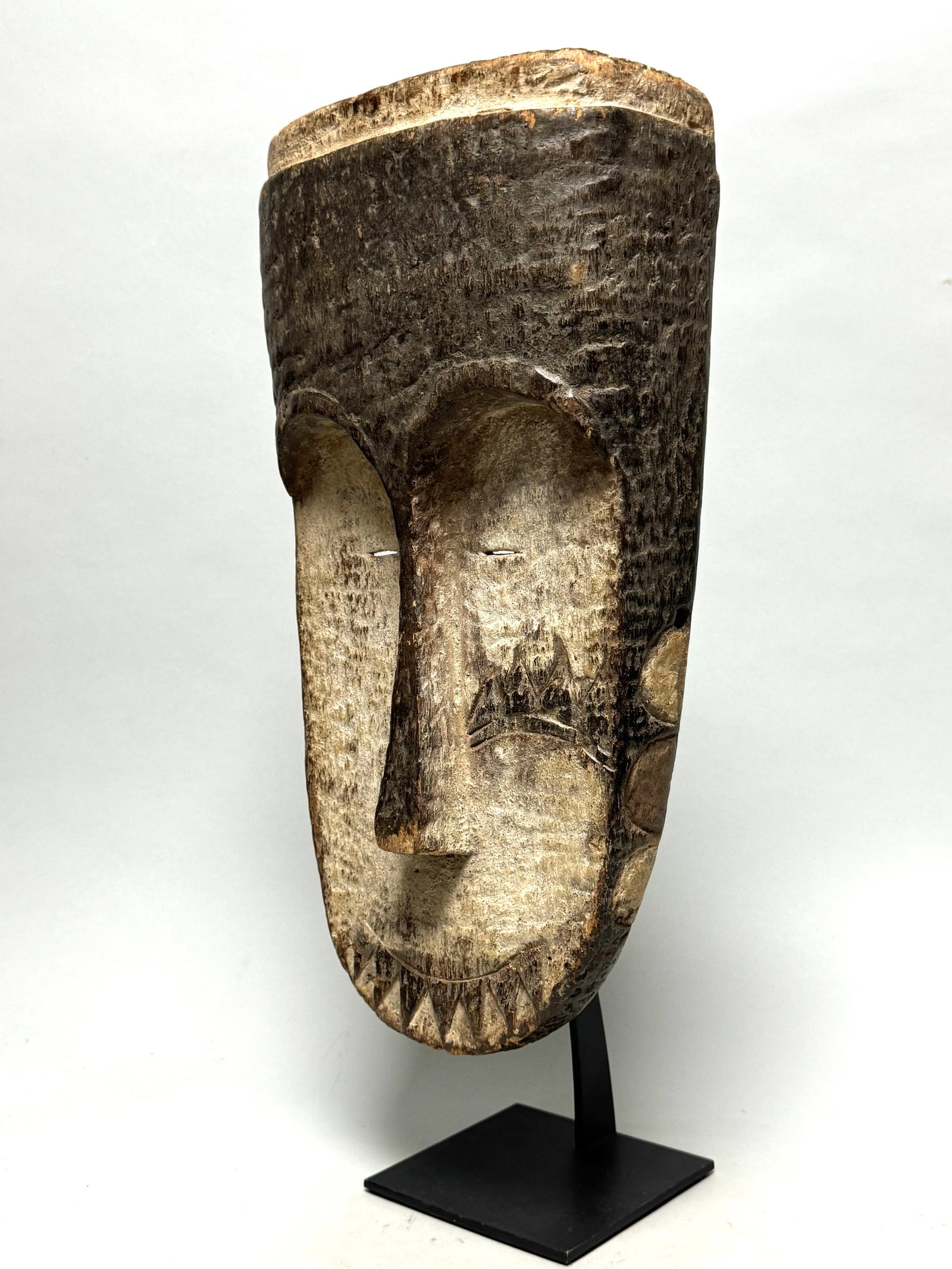 Ngil mask - Fang - Gabon, Africa: These masks were used by the male NGIL society that no longer exists today. This secret society was responsible for the initiation and they fought against witchcraft. The Ngil had a ritual purifying f