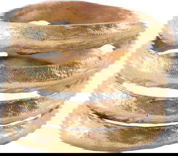 VIKING COIL RING, 9TH-10TH CENTURY, SIZE 10: Gold over bronze. 3 1/2 turns, size 10 . Low medial ridge, probably more prominent when new, now somewhat worn from use and burial. Made by the lost-wax process, coil beads, rings, and other