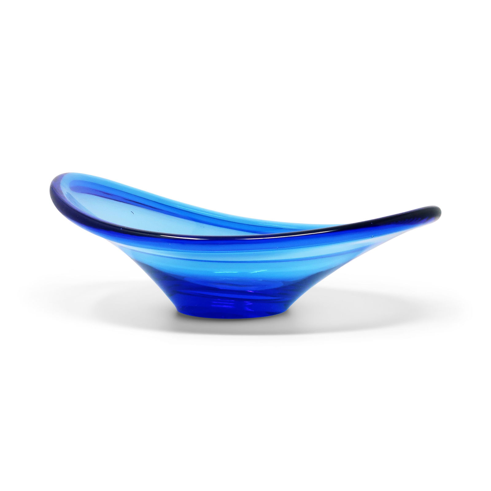 Scandinavian Modern Blue Glass Bowl by Per Lutken for Holmegaard: This glass bowl is an iconic design by Per Lutken for Holmegaard that's classic an example of Scandinavian Modern as a teak wastebasket. This example, in blue glass, is in very good vintage condition