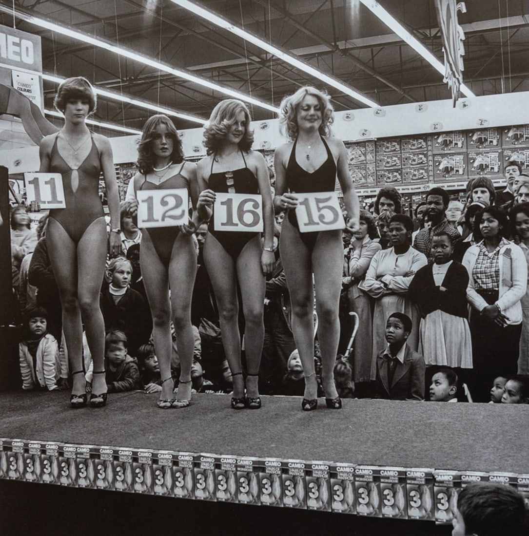 DAVID GOLDBLATT - Miss Lovely Legs Competition, 1979: Artist: David Goldblatt Title: Miss Lovely Legs Competition, 1979 Medium: Photo Litho, 1997, China Dimensions: 8.5x8.5" Description: Heat Wax Mounted on 11x14" Conservation Board Artist Bio: David Gol