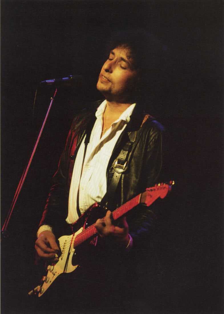 BARON WOLMAN - Bob Dylan "Slow Train Coming" , 1979: Artist: Baron Wolman Title: Bob Dylan "Slow Train Coming" Tour, San Francisco, 1979 Medium: Photo Litho, 2011, China Dimensions: 5.45x7.6" Description: Heat Wax Mounted on 8.5x11" Conservation Board A