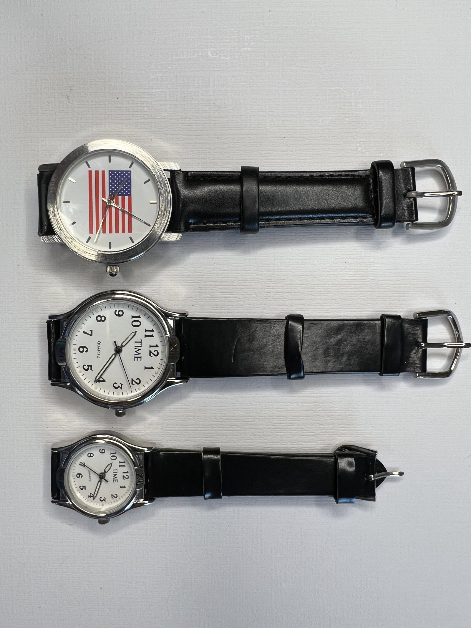 Time Magazine Watch Set: Title: Time Magazine Watch Set Gemstones:none Carat Weights:2.767 oz Size/Dimensions:approx 6.25 - 8 inch band, 2 with 1.25 inch watch faces, 1 with 1 inch watch face Reserve: $20.00 Shipping: Domesti