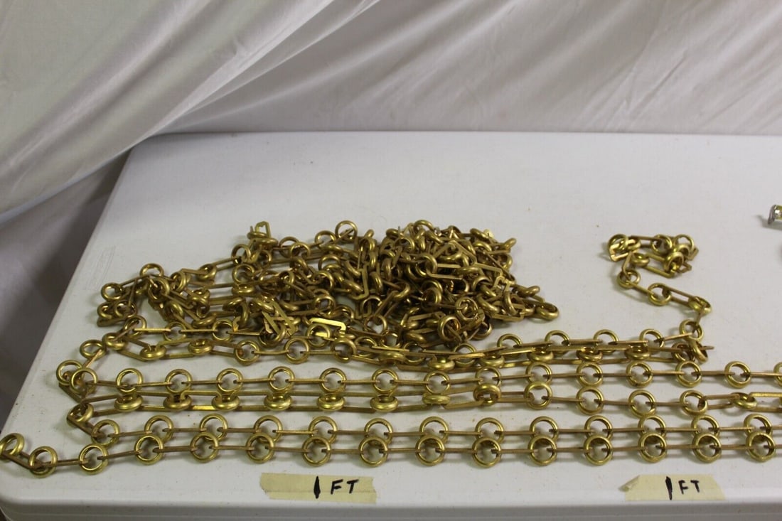 Chains for Chandeliers and Pendants Brass New: This chain is left over inventory from the Lighting Manufacturer in LA . Un-finished Brass . The links are rectangles at 1 1/2" with brass rings . This lot has 4 chains . One at 10 1/2 Foot and two at