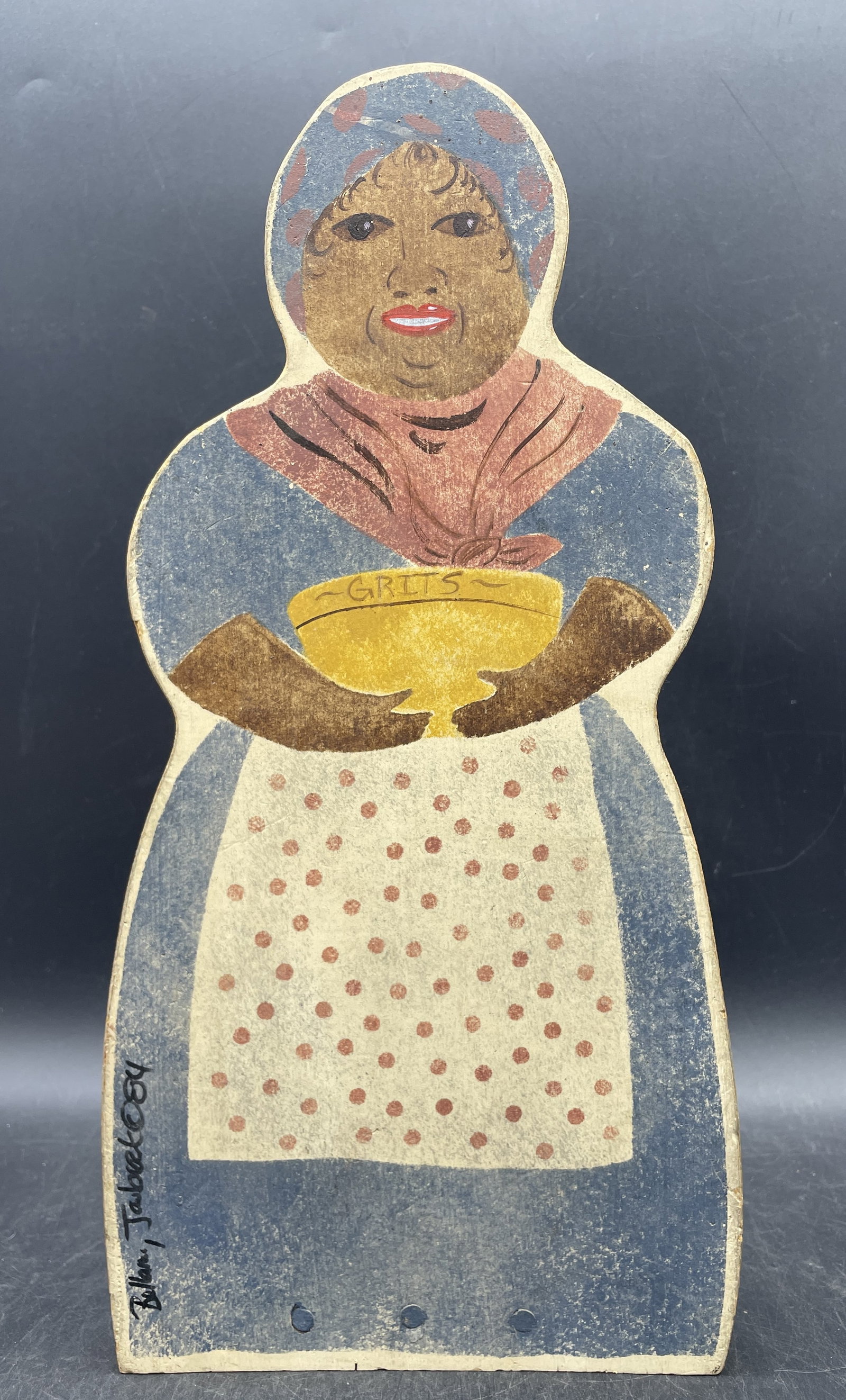 Folk Art Mammy Serving Grits Wooden Doorstop Signed: Title: Folk Art Mammy Serving Grits Wooden Doorstop Signed Date/Period: 1984 Dimension: approx. 13.5" tall, 6.75 wide and 6" deep Material: wood Additional Information: Folk Art Mammy Serving Grits Wo