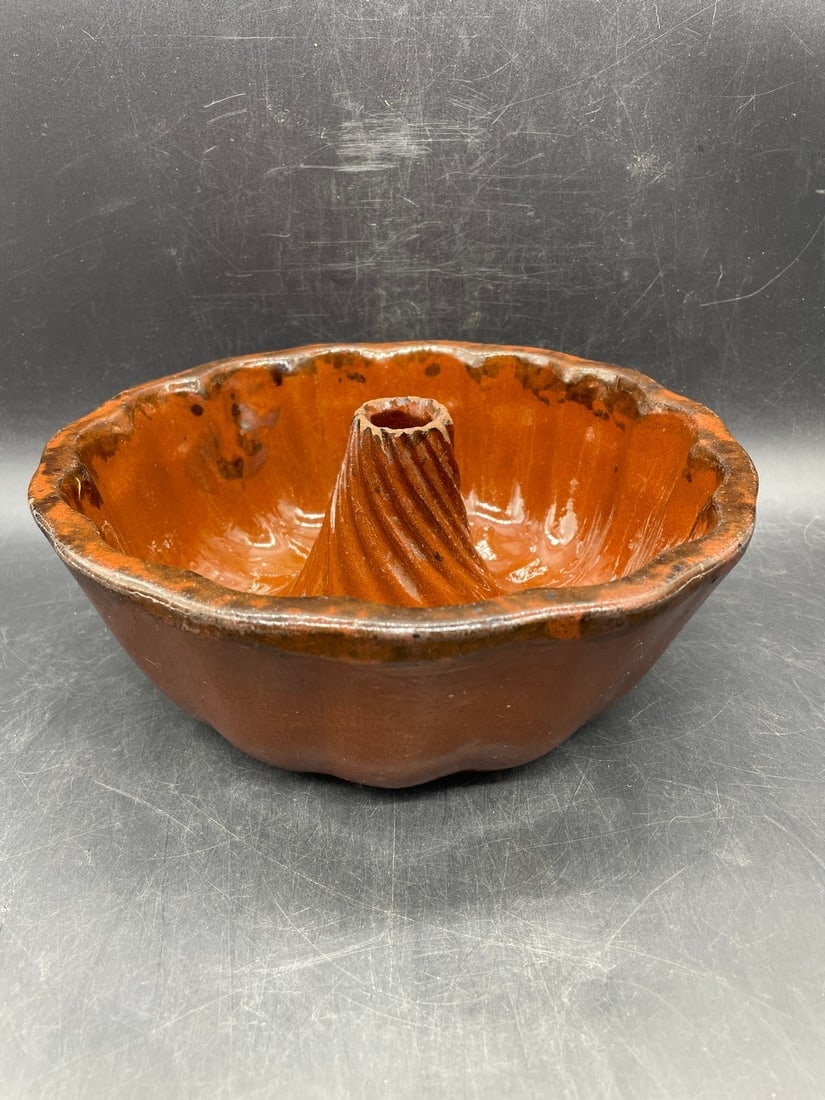 ANTIQUE REDWARE TURKS HEAD CAKE MOLD: Title: ANTIQUE REDWARE TURKS HEAD CAKE MOLD Date/Period: approx early 1900's Dimension: Approx. 8.5" diameter Material: redware Additional Information: ANTIQUE REDWARE TURKS HEAD CAKE MOLD Shipping: D