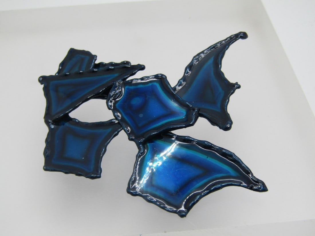 Enameled Mod Tiered Brooch, Hand Made, 3" by 2.75": Enameled Mod Tiered Brooch, Hand Made, 3" by 2.75". Stacked/tiered design with angular mixed shapes and with a higher black frame and areas in teal, blue, black. This is by David Wright of Oregon. Chr