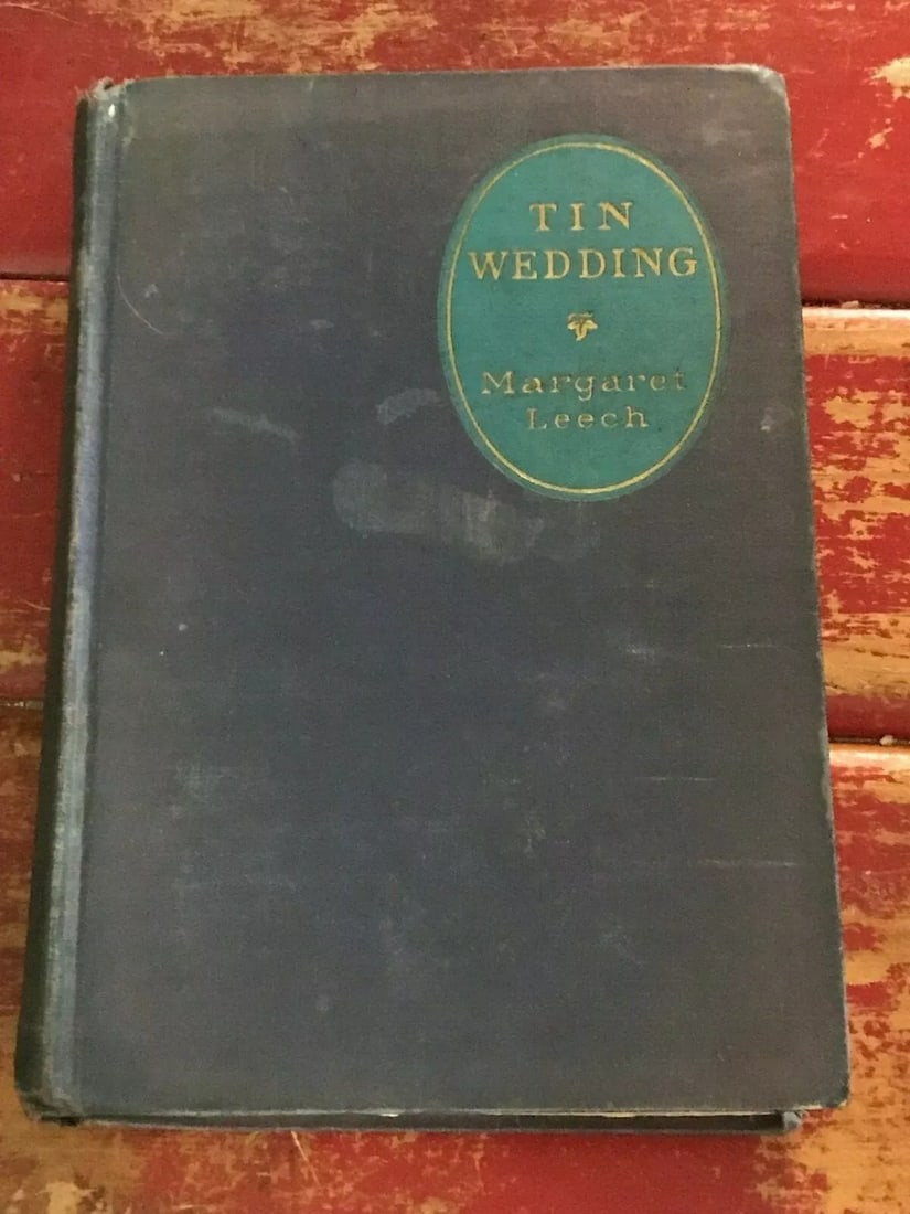Tin Wedding by Margaret Leech HC 1st/3rd 1926 Boni & Liveright Good Condition: TIN WEDDING BY MARGARET LEECH FIRST EDITION/THIRD PRINTING 1926 HARDCOVER BLUE CLOTH BOARDS, TITLE AND DECORATION TO FRONT COVER, Title to spine. 279 pages. Stain, wear, tears, fading to boards consis