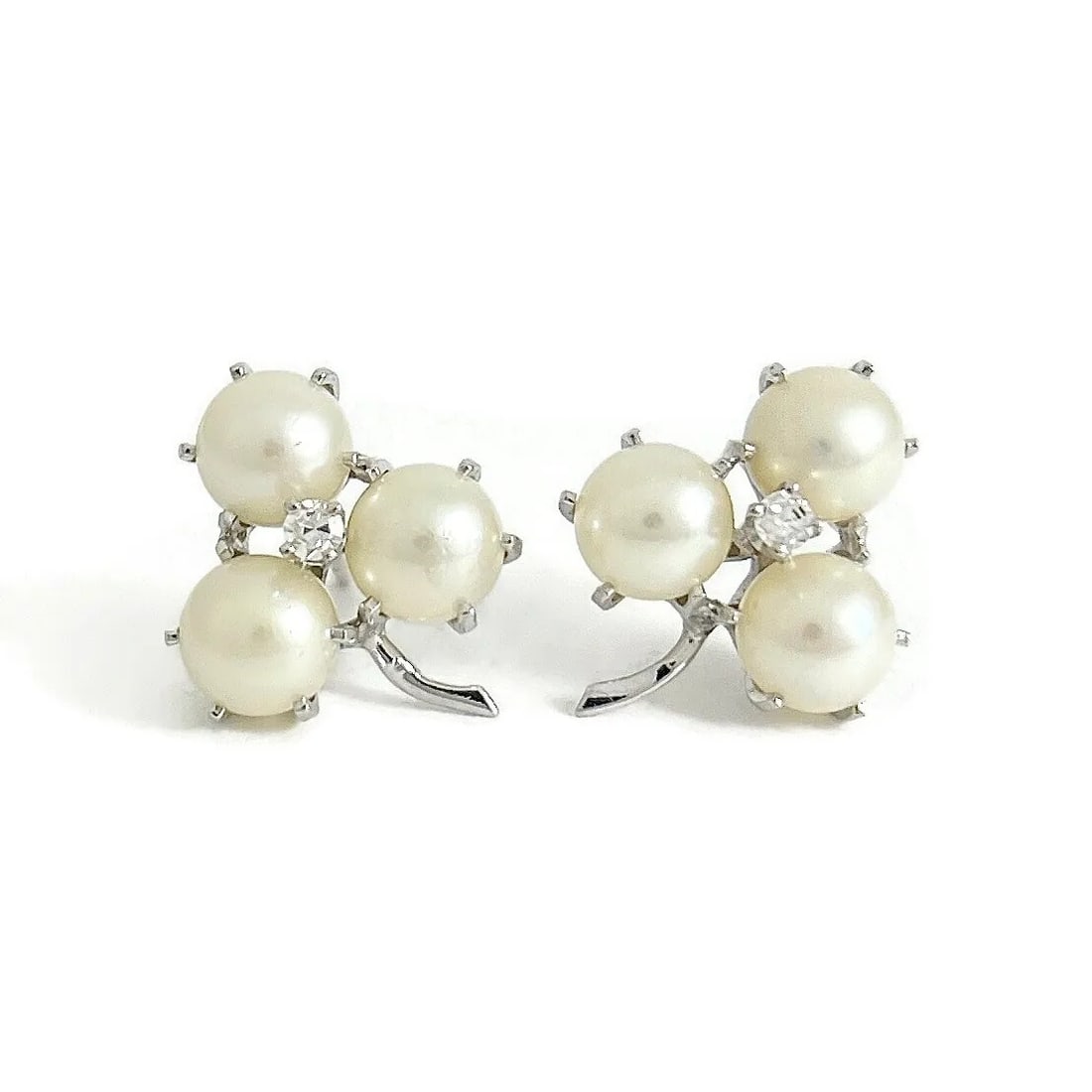 Vintage 1950's Pearl Cluster CZ Stud Earrings 12K White Gold, 4.06 Grams: Vintage 1950's Pearl Cluster CZ Stud Earrings 12K White Gold, 4.06 Grams These are beautiful earrings that will look great on any ears. Please let us know if you have any questions. Circa: 1950's Pear