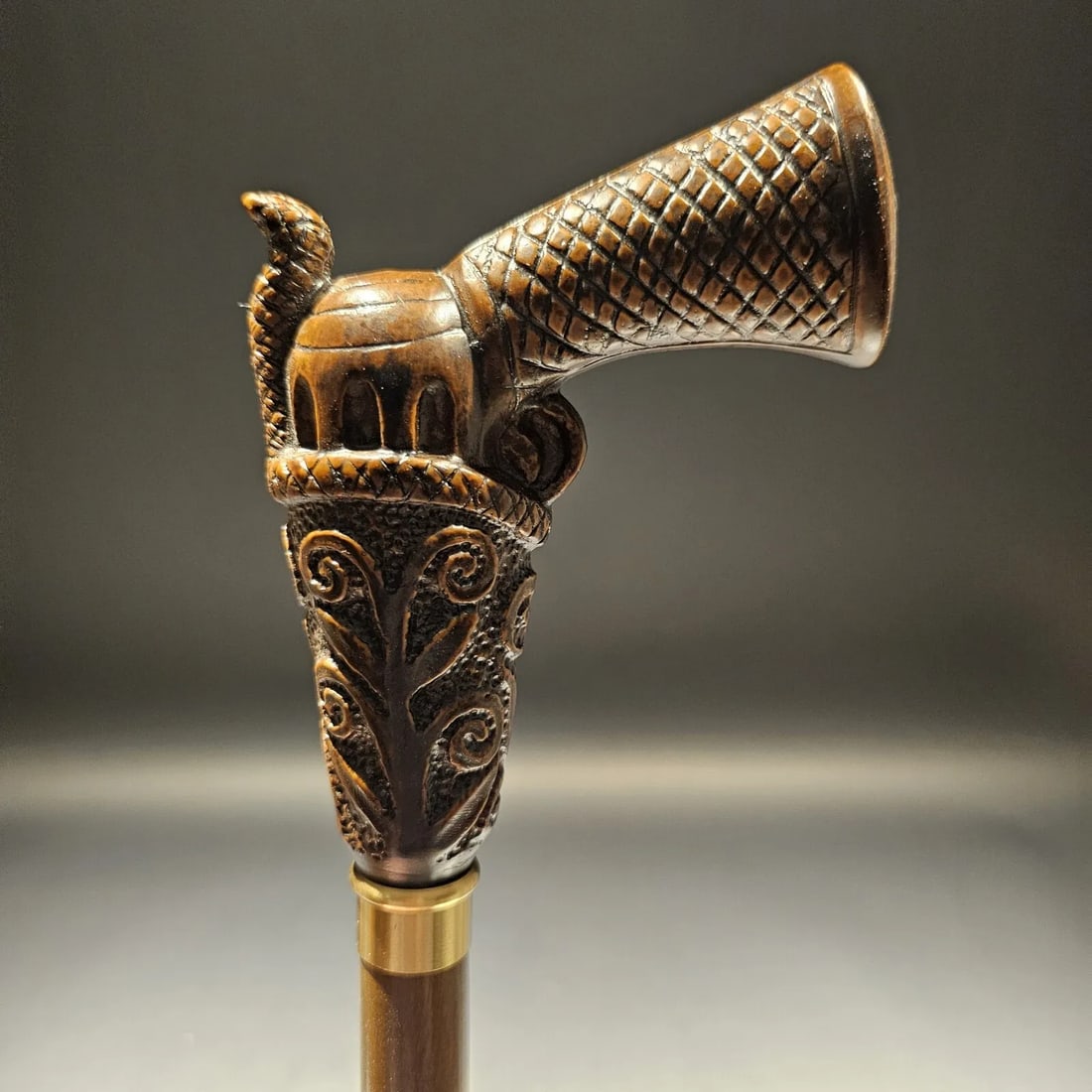 Wood Walking Cane With Gun Handle: This reproduction Italian cane features a firearm handle made of strong cellulose acetate from Italy. It's attached to a sturdy 3/4" beech wood shaft with a walnut lacquer finish and a stylish nickel-