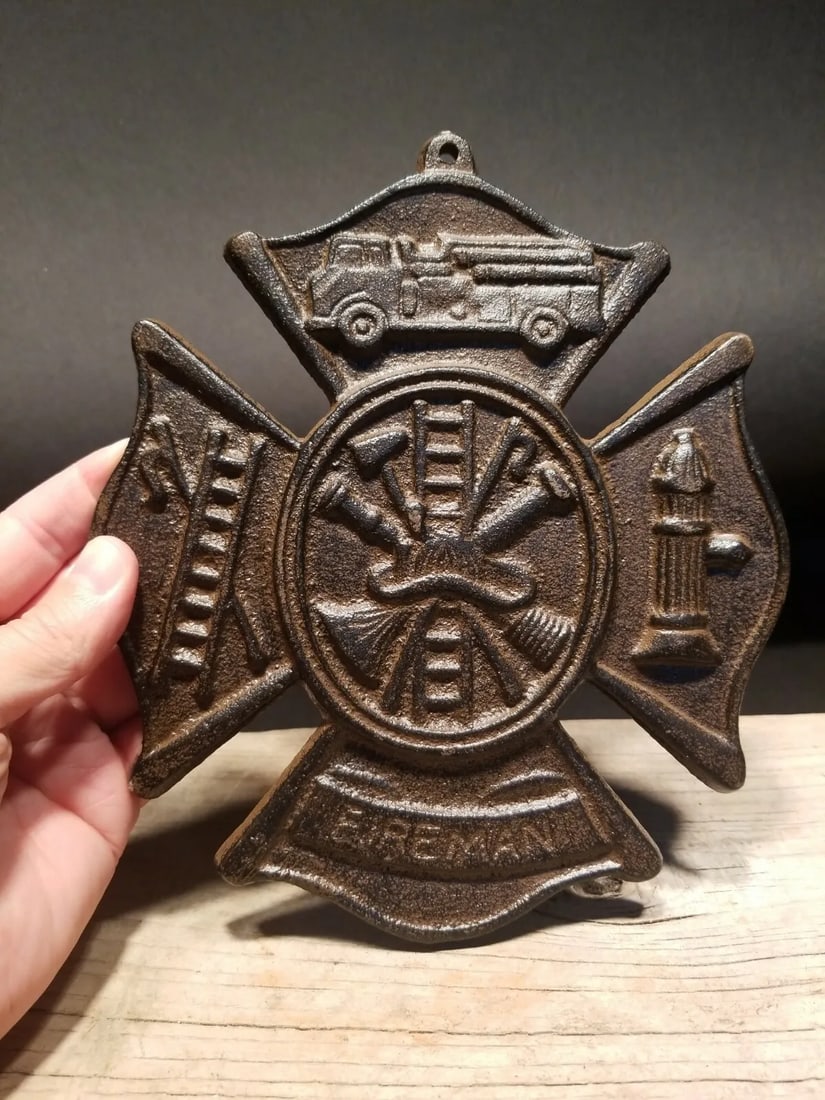 Cast Iron Rust Fire Fighter Plaque Fire Mark Sign: 9" Tall x 7 3/4" Wide Well made reproduction cast iron Fire Fighter Fireman plaque. Be sure to see the pictures.. looks old but is actually fairly new.. Reserve: $15.00 Shipping: Domestic: Flat-rate o