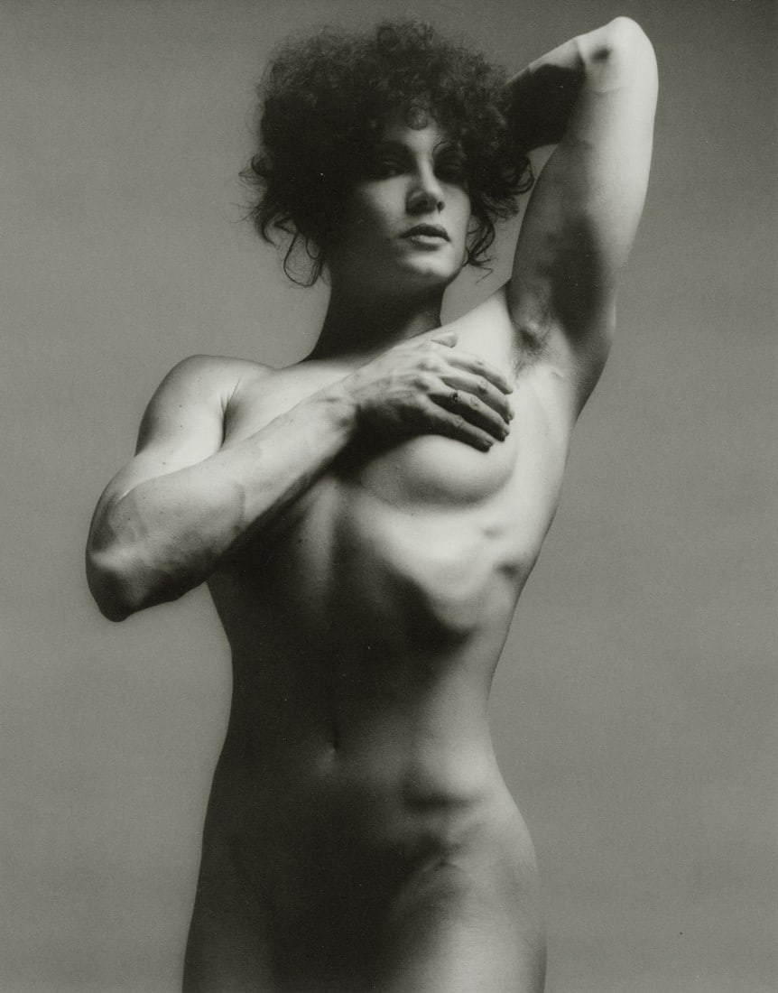 ROBERT MAPPLETHORPE - Lisa Lyon, 1982: Artist: Robert Mapplethorpe Title: Lisa Lyon, 1982 Medium: Photo Litho, 2016, Italy Dimensions: 6.9x8.7" Description: Heat Wax Mounted on 8.5x11" Conservation Board Artist Bio: Robert Mapplethorpe was