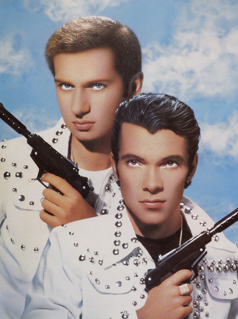 PIERRE & GILLES - Les Pistolets, 1987: Artist: Pierre & Gilles Title: Les Pistolets, 1987 Medium: Photo Litho, 1993, Hong Kong Dimensions: 8.75x11.7" Description: Heat Wax Mounted on 12x16" Conservation Board Artist Bio: Pierre Commoy and 