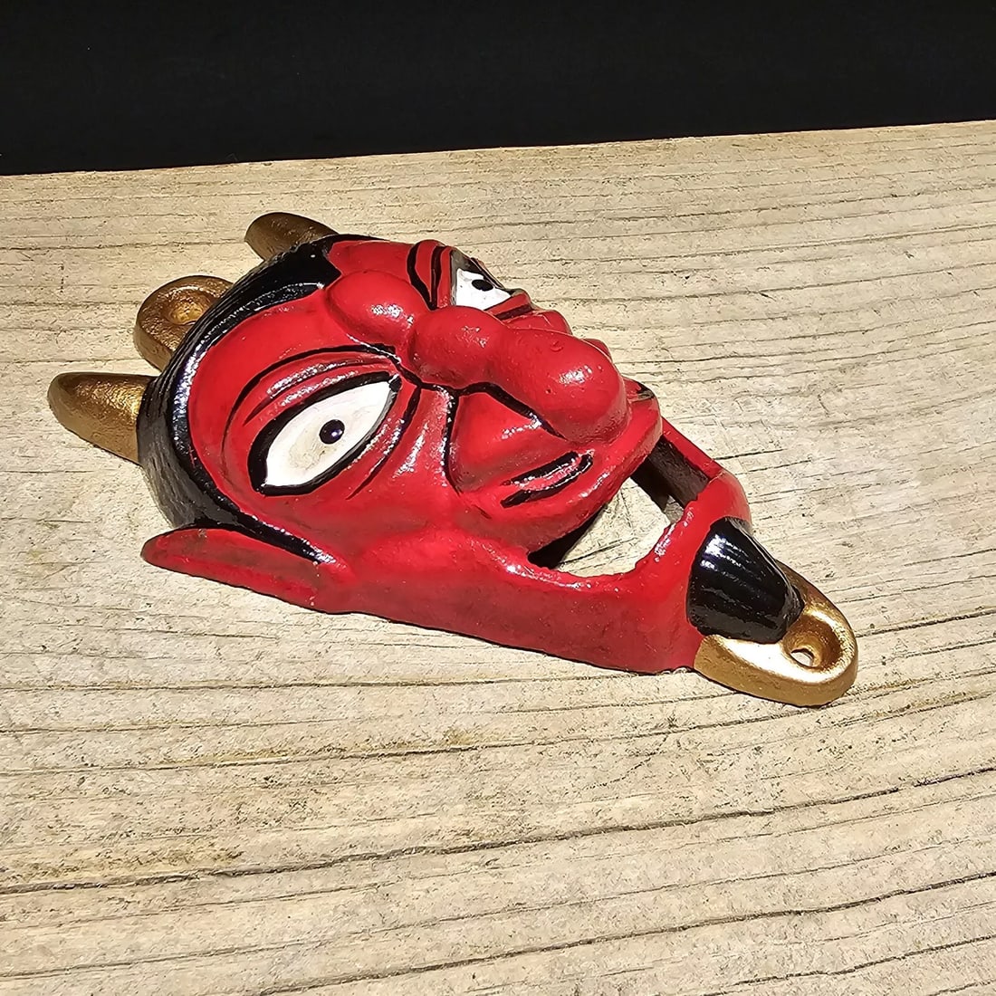 Cast Iron folk art Devil Wall mount Bottle Opener: 5 3/4" Tall x 4" Wide Great reproduction cast iron bottle opener. This piece was made to look just like an antique, but is new. Reserve: $15.00 Shipping: Domestic: Flat-rate of $5.00 to anywhere withi