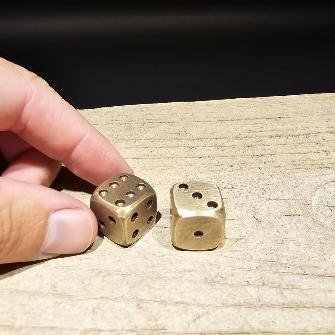 2 1/2" Brass Gaming Dice: (2) 1/2" wide dice Introducing the extraordinary Wonderful Reproduction Set of Dice—a testament to the artistry and craftsmanship of handmade dice. Each die in this set bears the charming signs