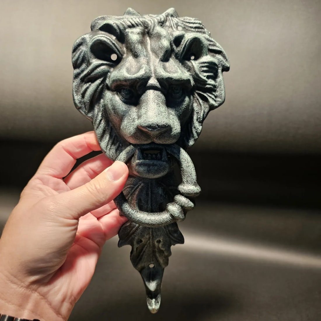 Cast Verdi Green Iron Lion Door Knocker w Hook: 10 3/4" Tall x 5 1/4" wide 2 lbs 7oz Nice heavy quality reproduction cast iron door knocker! As you can see this is a solid lion face door knocker. The ring in the lions mouth serves as the knocker. N