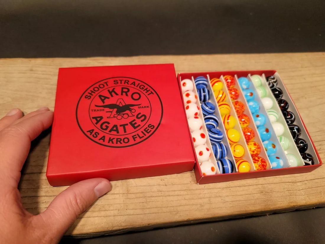 Akro Agates Marble set w Box: 5/8" Marbles as shown. Wonderful reproduction "fantasy box" with modern glass marbles . Great Set! Reserve: $30.00 Shipping: Domestic: Flat-rate of $7.00 to anywhere within the contiguous U.S. Interna