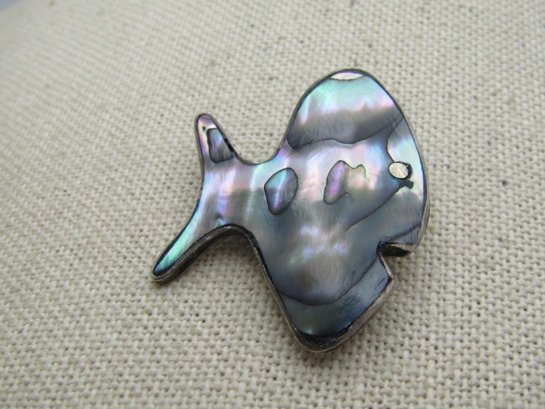 Vintage Sterling Abalone Fish Brooch, Taxco, Mexico, 1960's-1970's: Vintage Sterling Abalone Fish Brooch, Taxco, Mexico, 1960's-1970's. Cute comical fish that is appx. 1.25" tall and 1-1/8" wide - slightly domed inlaid abalone. Tropical fish with locking clasp. It is 