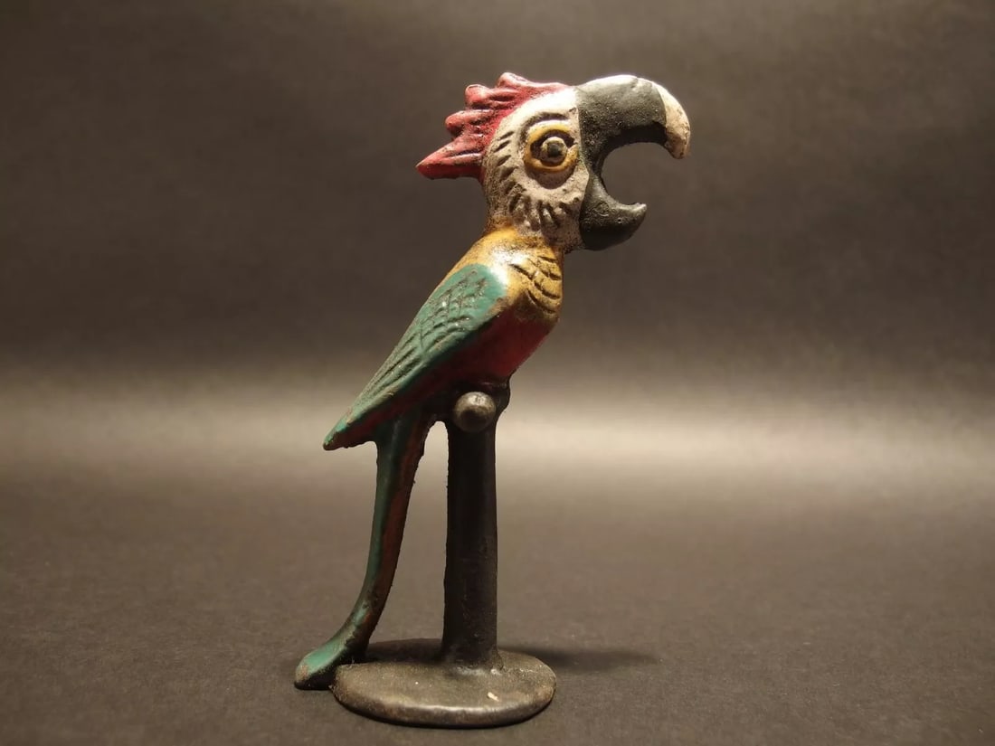 Cast Iron Parrot Beer Bottle Opener bar tool: 5 1/4" Tall Great reproduction cast iron bottle opener. This piece was made to look just like an antique, but is new. Great for use or display! Reserve: $20.00 Shipping: Domestic: Flat-rate of $8.00 t