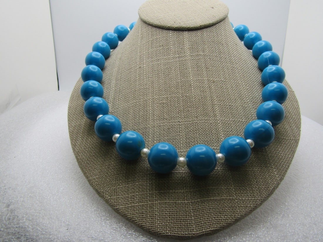 Vintage Teal Lucite Beaded Necklace, Faux Pearls, 22", 1960's-1970's: Vintage Teal Lucite Beaded Necklace, Faux Pearls, 22", 1960's-1970's. The teal beads are the same size at appx 16mm and between each bead there is a white faux pearl that is appx. 4.5mm. Barrel clasp.
